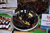 Myanmar - Kyaikhtiyo, elixirs made from wild animal parts are on sale. 